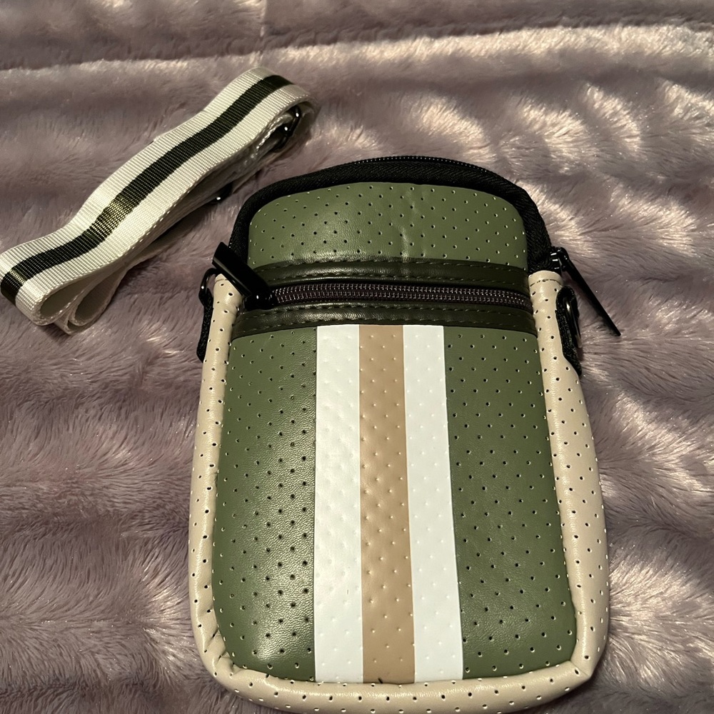 HAUTE SHORE Women’s crossbody bag. SIZE:  4.75"W x 7"H x 1.5"D. Green/tan/beige